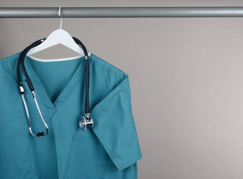 Medical school student blue clothing with stethoscope on hanger